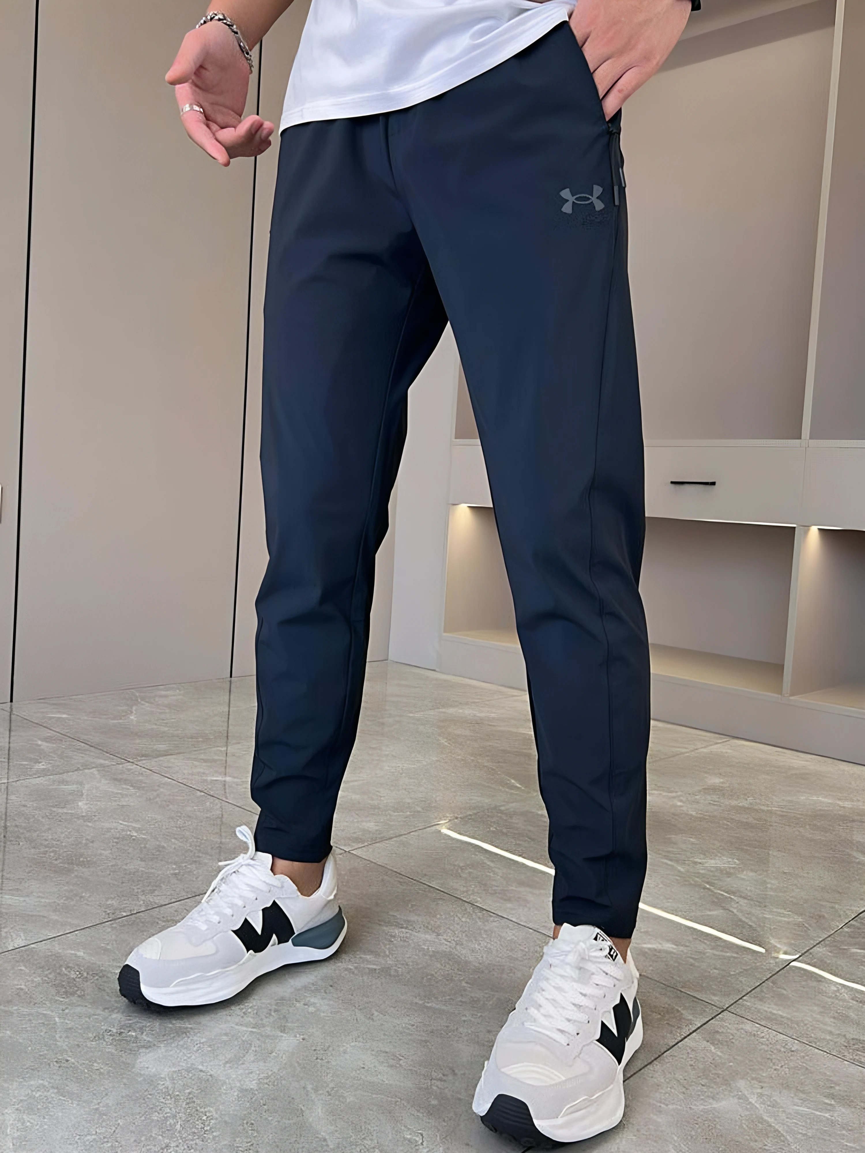Pantalons ultra-élastiques unisexe - Under Armour